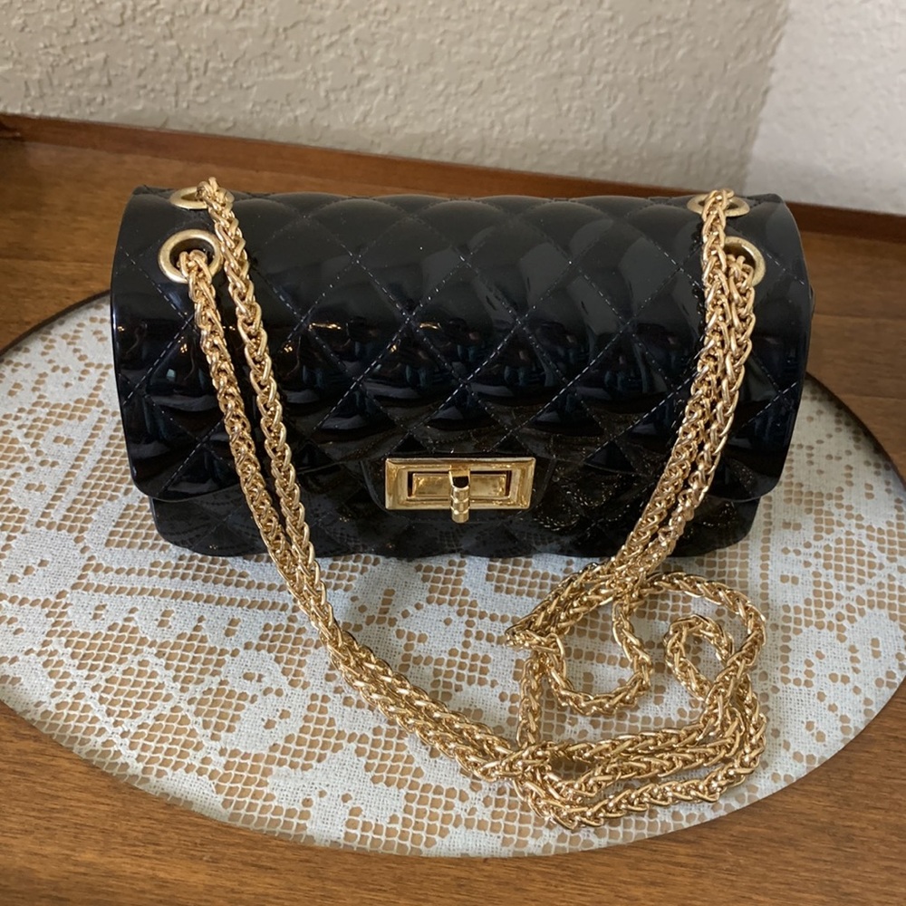 Black Patent Convertible Mini Bag with
Gold Metal Accents